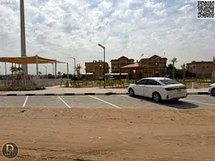 Modern villa for sale, 5000 sq ft, in Al Muwaihat 1 area, Ajman. Excellent location opposite a park