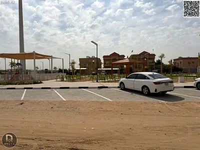 Modern villa for sale, 5000 sq ft, in Al Muwaihat 1 area, Ajman. Excellent location opposite a park and mosque.