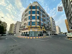 A modern investment building in Al Hamidiya with an ideal mix of shops and residential apartments.