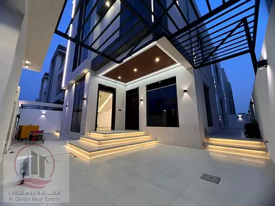 Corner villa for sale in Ajman, Al Yasmin area. 6 master bedrooms, majlis, 2 living rooms, and a maid's room. Freehold ownership available to all nati