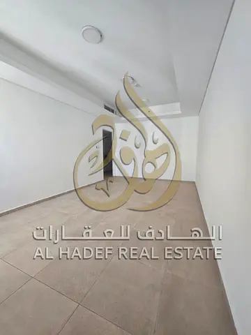 Two-bedroom apartment for rent in Al Qasimia, near Mega Mall, with one month free and free parking.