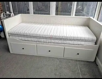 Beautiful white daybed with spacious storage. Perfect for relaxing and saving space in your home.