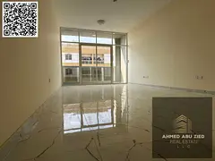 Two bedrooms, a living room, and a balcony in Al Jurf 3. Both bedrooms are master suites with three