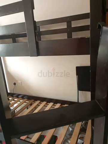 A wooden bed in very good condition, and it comes with movable bed frame without mattress frorm IKEA