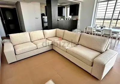 In brand new condition IKEA kivk corner sofa beige perfect condition