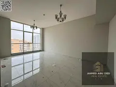 First-tenant 2BR apartment in Al Jurf, annual rent, private parking, central AC, balcony, elegant fi