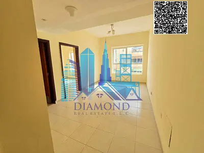 A vacant one-bedroom apartment is available for immediate occupancy or investment for sale in Garden City Towers, Ajman.