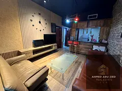 Furnished 1BR apartment in Al Nuaimiya 3, annual rent, new furniture, balcony, 2 bathrooms, central