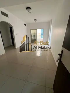 Two-bedroom apartment with a living room and balcony for rent in Al Taawun | Directly on the Dubai e