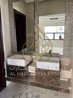 Modern villa for rent in Al-Raqiba 1 - 2 floors - 5 master bedrooms - parking for 6 cars - 8000 sq f