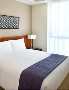 Modern sophistication with urban views in fully furnished 1 Bedroom Apartment