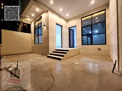 Villa for sale in Ajman, Al Helio area. 3 master bedrooms, majlis, living room, maid's room, and