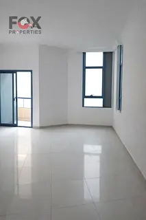 2BR apartment for sale in Ajman Corniche Towers, large hall, maid’s room, spacious layout, great p