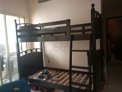 A wooden bed in very good condition, and it comes with movable bed frame(without mattress)