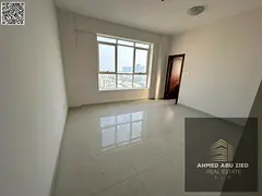 2BR hall apartment with private parking, first tenant at Corniche, Ajman. 2 masters, 3 baths, AC, ba