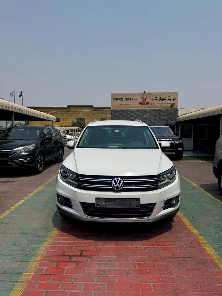 Volkswagen Tiguan 2013 — photo 1 of 12