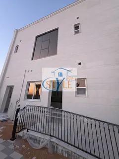 A modern villa for sale in Al Hashie, Sharjah. The property features a contemporary design with high