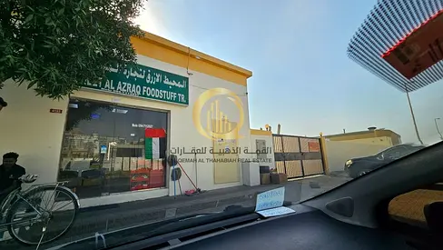 Warehouse for sale in Sajaa area. Freehold ownership for all Arab nationals. 99-year lease for foreigners. Strategic location near Emirates Road.