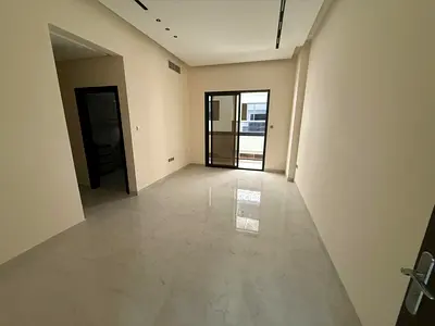 For annual rent in Ajman Apartment consisting of two bedrooms, a living room, and three bathrooms First occupancy, Al Jurf 3 area