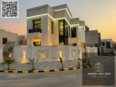Villa in Al Yasmin area, corner location on two streets, first occupancy. Consists of two floors and a roof with a spacious yard, parking space, centr