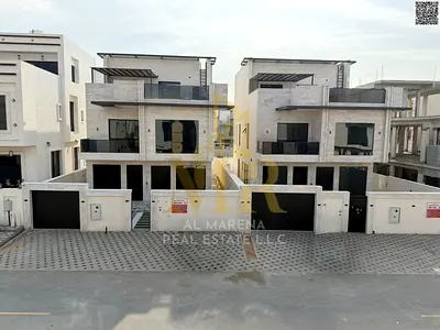 Luxury villa for sale in Al Bahia, two floors and a roof, all-inclusive price, in one of the most prestigious areas of Ajman.