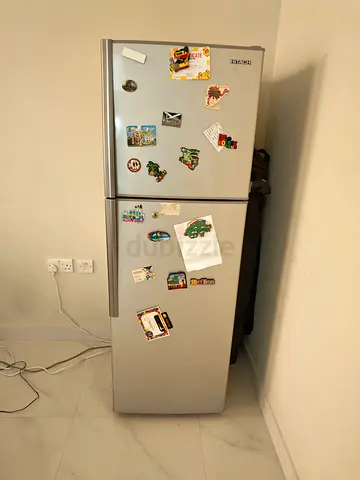 Silver Refrigerator with Stickers