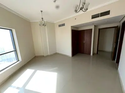 A spacious and luxurious apartment consisting of two bedrooms, a large living room, a maid's room, a laundry room, and four bathrooms, with a modern a