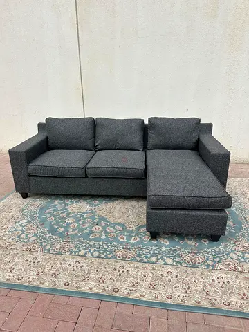 L-shaped grey sofa with left and right fitting, cushions for optimal comfort and support.