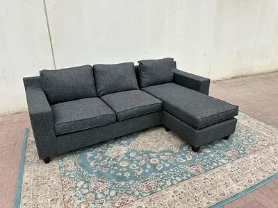 L-shaped grey sofa with left and right fitting, posture support during long seating.