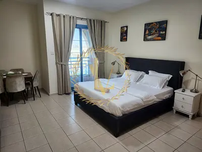 Spacious Studio with Balcony in International City Persia Cluster - 10 minutes to Airport