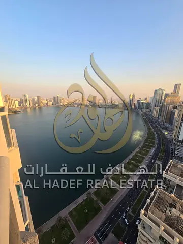 A spacious and modern, brand-new apartment in Al Majaz 3, featuring an elegant design and comprising two bedrooms, a living room, and a maid's room. S