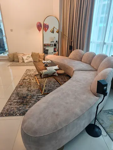 Beige velvet curved corner sofa