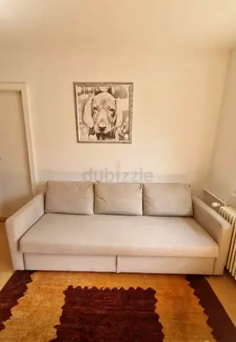 Modern Beige 3-Seater Sofa Bed – Elegant beige fabric with a sturdy frame, providing both seating a