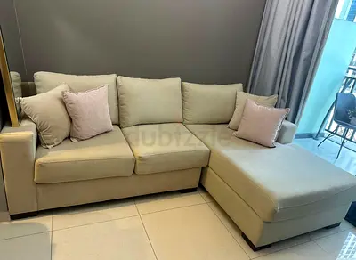 Comfortable L-Shaped Sofa with Cushions