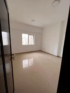 For rent in Al Nahda: 2BR + hall, open kitchen, comfortable layout, prime location near Dubai exit a