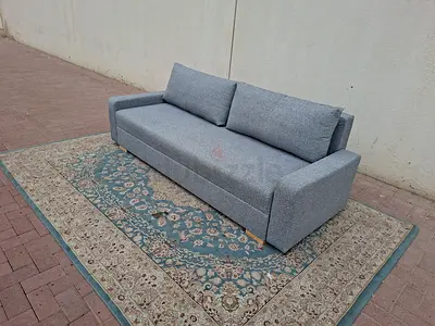 Modern Design Stylish grey three-seater sofa bed with a modern and elegant look suitable for living