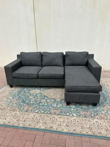 L-shaped grey sofa with left and right fitting, durable joints for long-lasting stability.