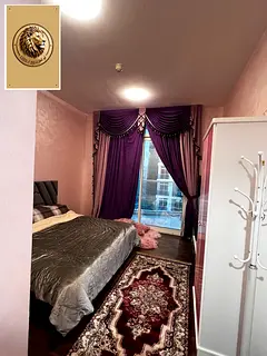 A distinctive apartment is available for rent in Al Waha Towers in the Al Rashidiya 1 area, in a liv