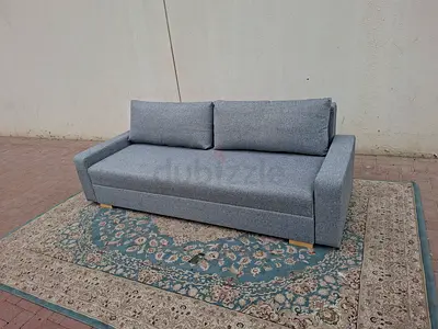 Hidden Storage SpaceModern Design Stylish grey three-seater sofa bed with a modern and elegant look