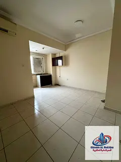 Beautiful and spacious studio in Al Musalla, Sharjah, featuring a separate kitchen .
