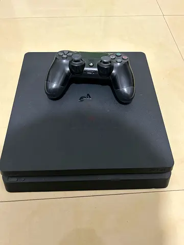Playstation 4 (slim) with one controller .