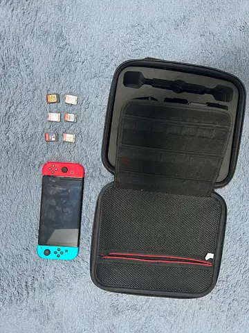 Nintendo switch with 6 games and a bag all in perfect condition