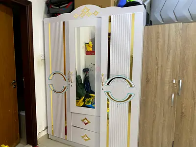 Elegant Wardrobe with Mirror and Drawers