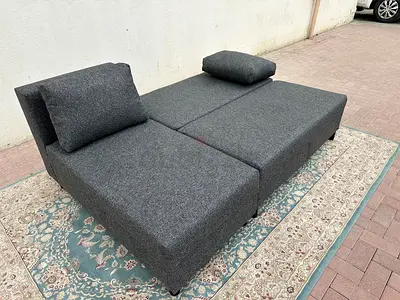 Space-saving L-Shape Sofa Bed. Soft cushions, durable fabric, and large storage compartment.