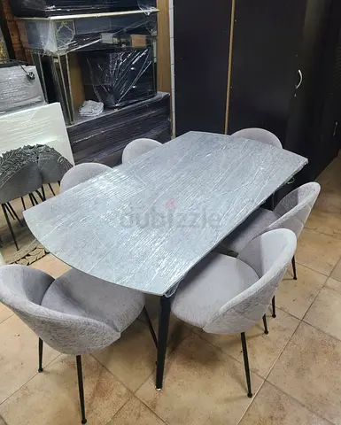 Modern Dining Table with Plush Chairs