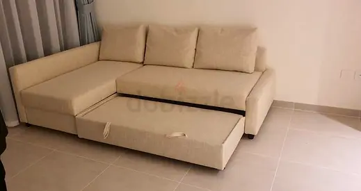 living room. Stylish L-Shape Sofa Bed – Beige colour, spacious storage, comfortable for sitting and