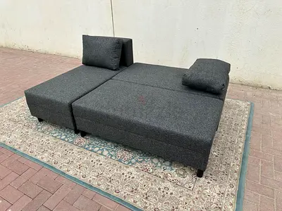 Modern Grey Sofa Bed with chaise design. Strong frame, soft cushions, and large storage under the se