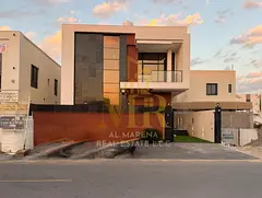 A beautifully designed villa in Al Bahia, Ajman, offering spacious interiors, a modern design, and a