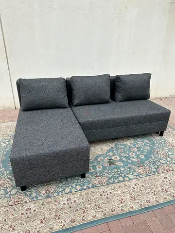 Stylish Grey Sofa Bed with large storage space. Strong frame and soft cushions. Good condition and r