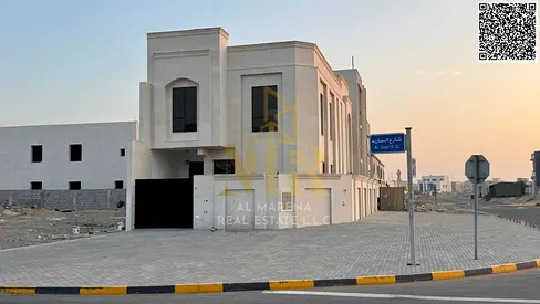 Corner villa for sale in Al-Haliyo 1 – Two floors | 4 master bedrooms + Majlis + Living room + Open kitchen to the living room, price including regist